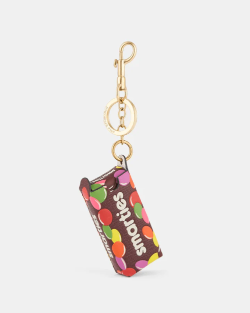 Anya Hindmarch Smarties Charm Grainy Capra in Mahogany