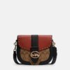Coach Georgie Saddle Bag In Colorblock Signature Canvas With Rivets