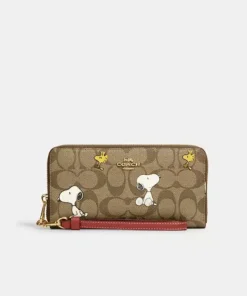 Coach X Peanuts Long Zip Around Wallet In Signature Canvas With Snoopy Woodstock Print